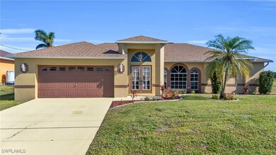 View of front facade with a garage and a front law
