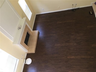 Detailed view of wood finished floors and baseboards