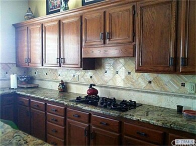 Hand stained cabinets, granite counters and custom
