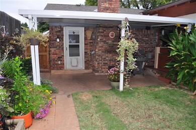 Backyard – Large covered patio, storage shed, 8ft 