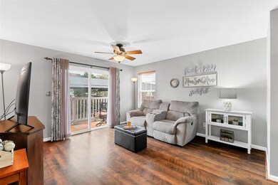 Living room has glass slider to private deck!