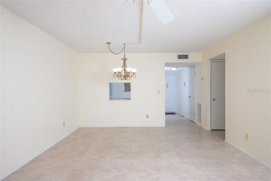 Living / Dining space from N to S. Entry door at t