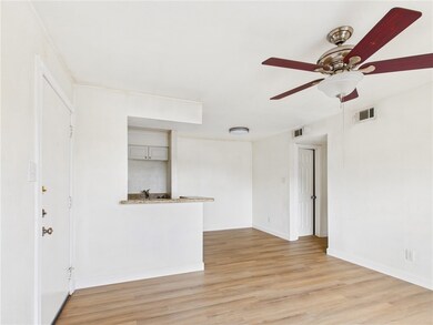 Unfurnished living room featuring light wood finis
