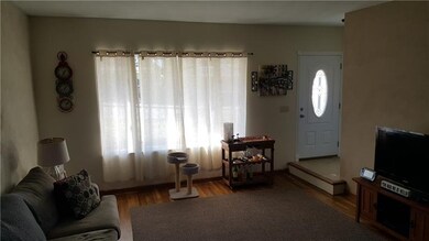Living room with beautiful hardwood flooring and l