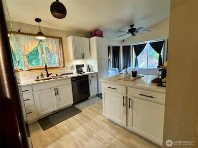 Updated kitchen, newer flooring,  countertop and cabinets with soft close drawers.