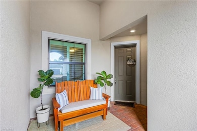 Property entrance with stucco siding