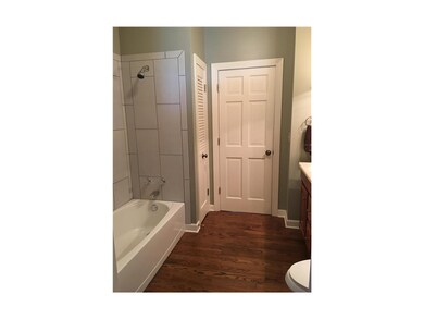Full bath on main level.  Brand new tile surroundi