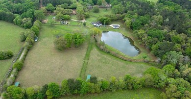 Rear view of property. Note the three run in sheds