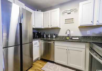 Kitchen featuring light hardwood / wood-style floo