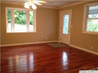 Great Room has hardwood floors and a bay window.