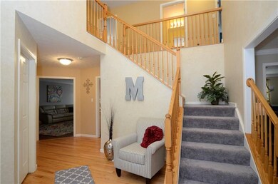 Dramatic two-story foyer with re-sanded hardwood f