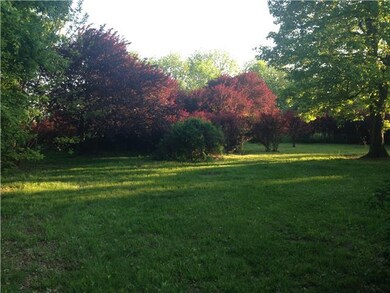 Large shaded side and back yard