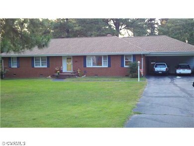Exterior Front - Attached carport with breezway to