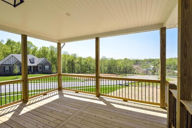 large covered deck with nice flat backyard