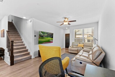 Living area with light wood finished floors, base
