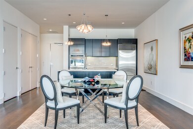 Dining space featuring dark wood-type flooring, recessed lighting, and a chandelier