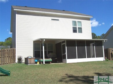 Rear view of the home showing the screened porch a