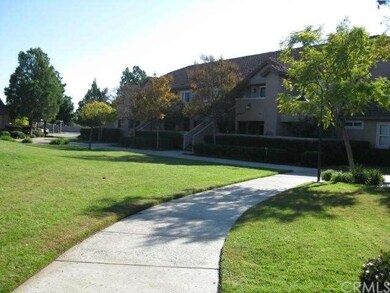 Walkway leading towards the property. The pool and