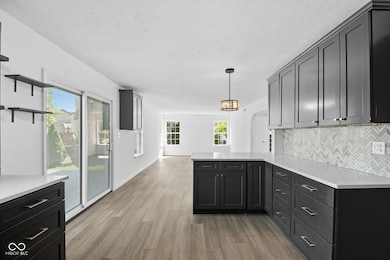 Kitchen breakfast bar with view of large room beyond for whatever you want to make it.