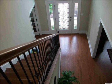 Looking down into the foyer. Notice the gleaming hardwoods.