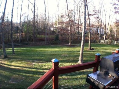 Enclosed rear yard on large lot.