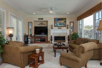 Spacious family room with ceiling fan, neutral car