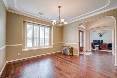 Formal dining room with plantation shutters letting in lots of light. Host the holidays at your home.