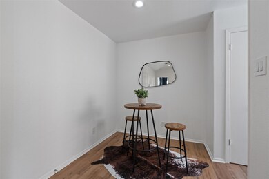 Dining area featuring light wood finished floors 