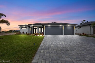 Prairie-style home with stucco siding, driveway, a