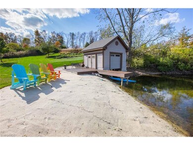 Newer Boathouse (2013) with dock, sundeck, and bea