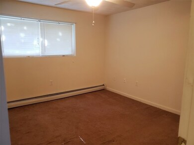 LIVING ROOM WITH LARGE WINDOW TO LET LIGHT IN
