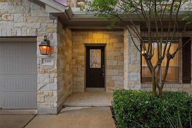 Property entrance featuring stone siding