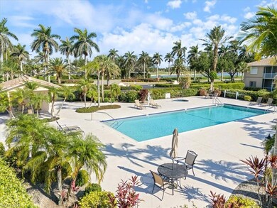 Community pool with a patio