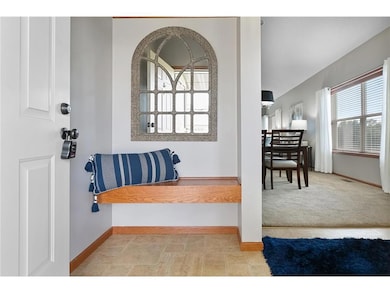 Main level foyer with a built in bench