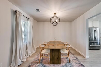 Unfurnished dining area with light wood finished f