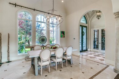 Beautiful stone floors grace the formal dining roo