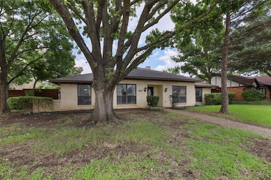 Ranch-style home featuring brick siding