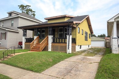 Driveway & view of 2-car garage.