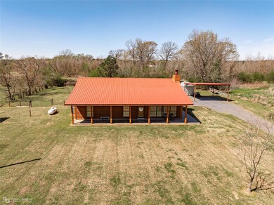 View of front of home featuring a front lawn, a ch