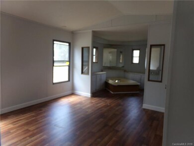 Master bedroom/bathroom with soaking tub