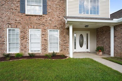Pretty landscaping along the front of the house. W