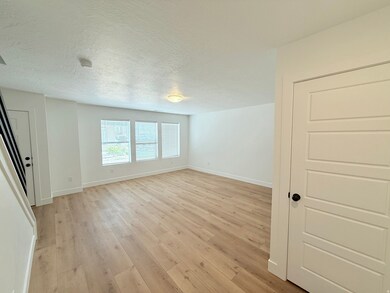 Living room featuring laminate wood floors