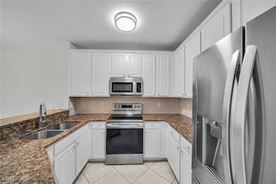 Kitchen featuring appliances with stainless steel