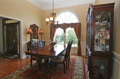 The dining room elliptical window adds an attracti