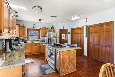 kitchen with updated appliances, granite counterto
