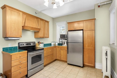 maple cabinets and colorful playful countertops