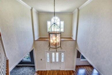 An impressive two-story foyer welcomes your guests