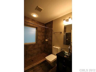 Bathroom with heated tile floors and wide shower w