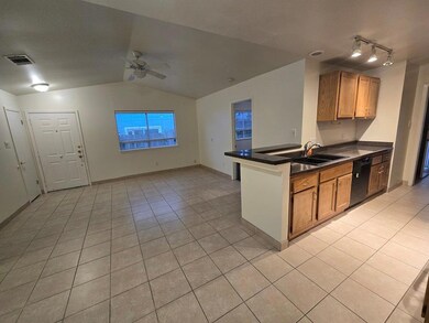 Kitchen featuring ceiling fan, lofted ceiling, da