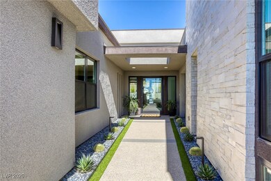 Entrance to property with stucco siding